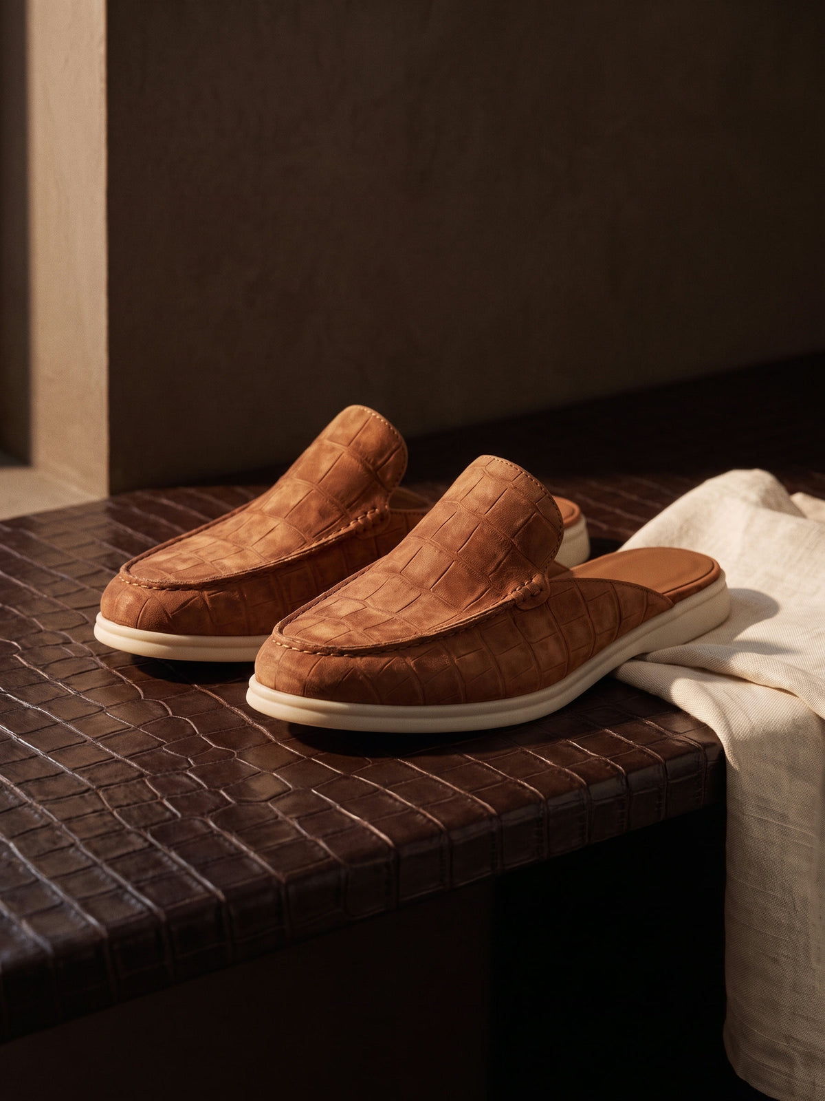 The Antibes Mule — Brown, still life on crocodile leather