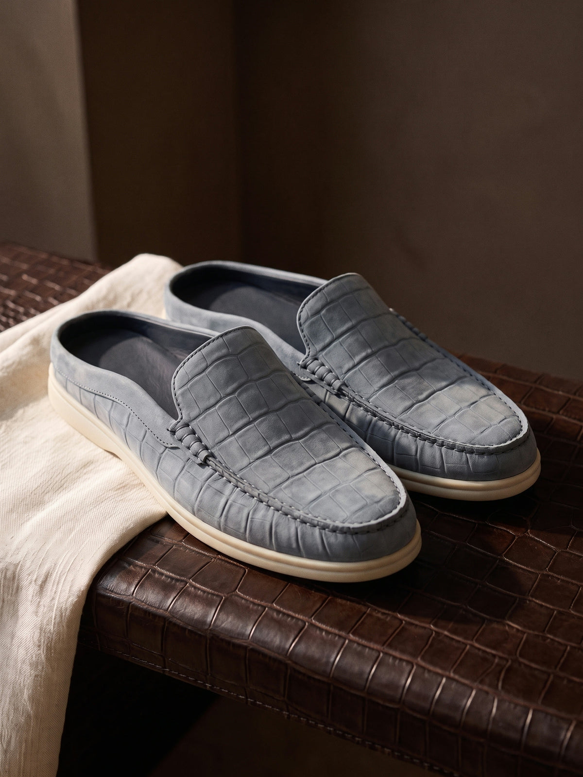 The Antibes Mule — Slate, still life on crocodile leather