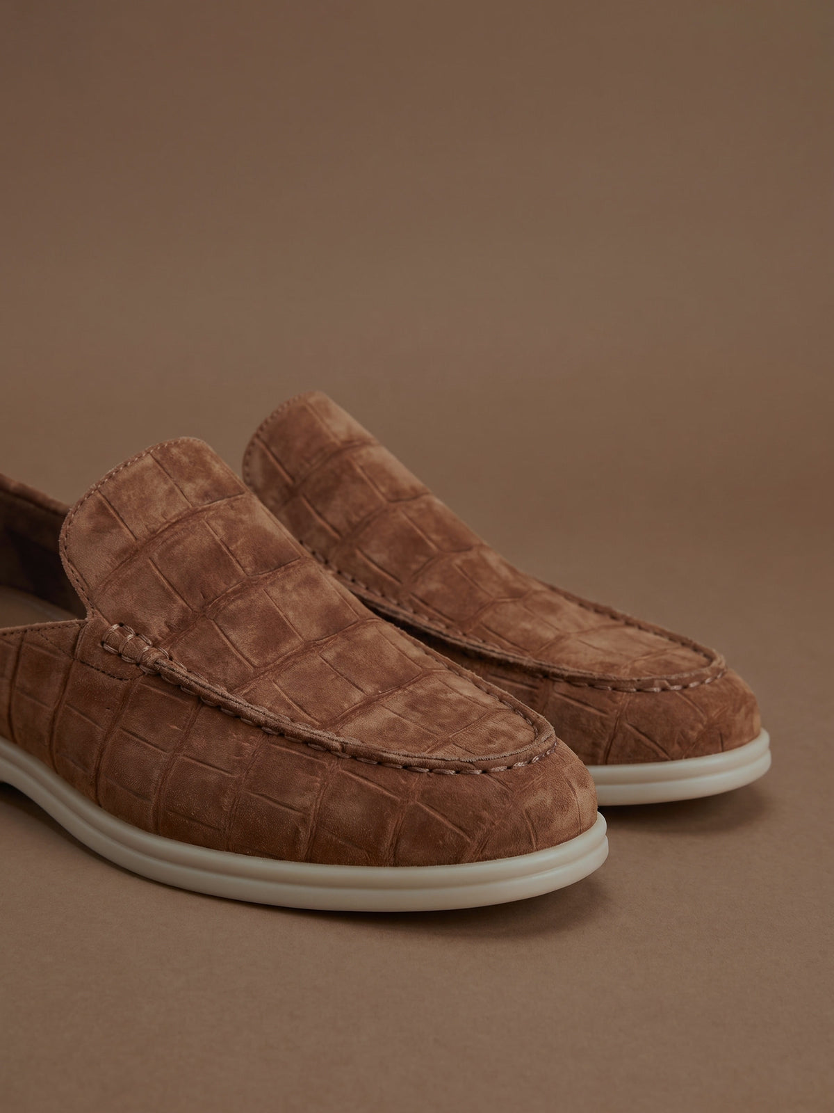 The Antibes Mule — Brown, detail of the hand-stitched moccasin seam and embossed nubuck
