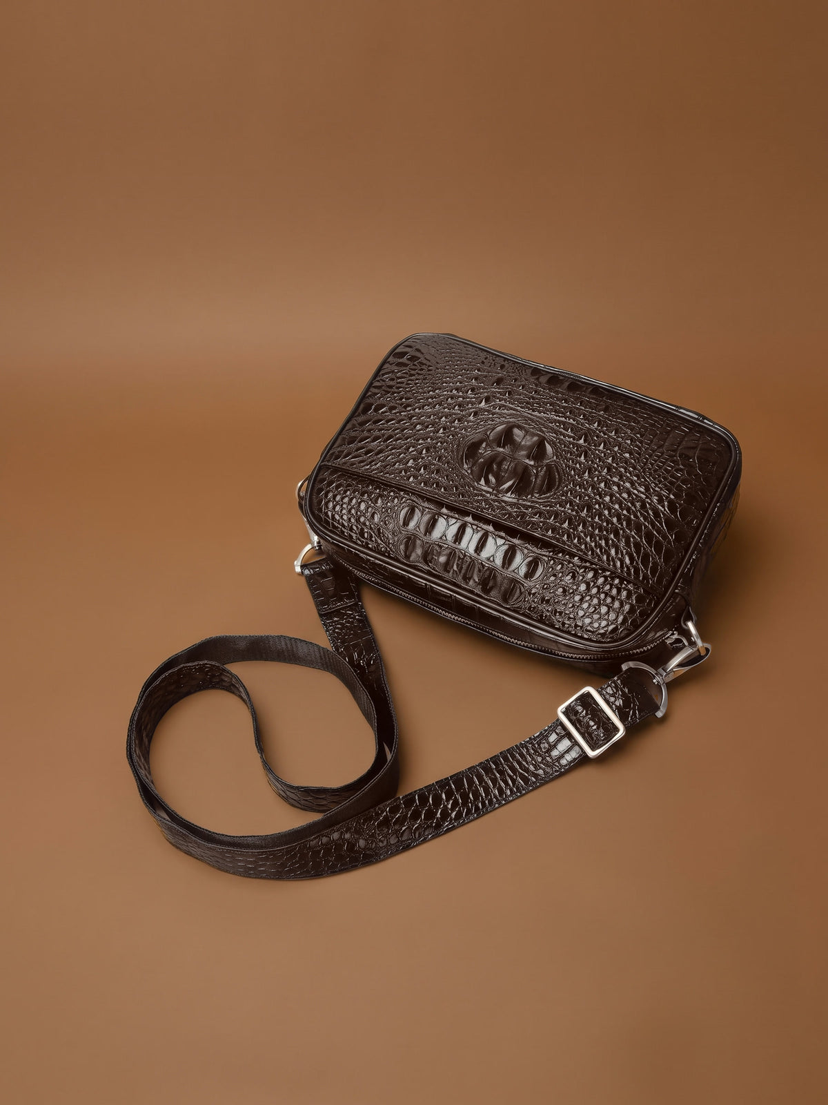 The Cassis Camera Bag — Brown, from above with its strap