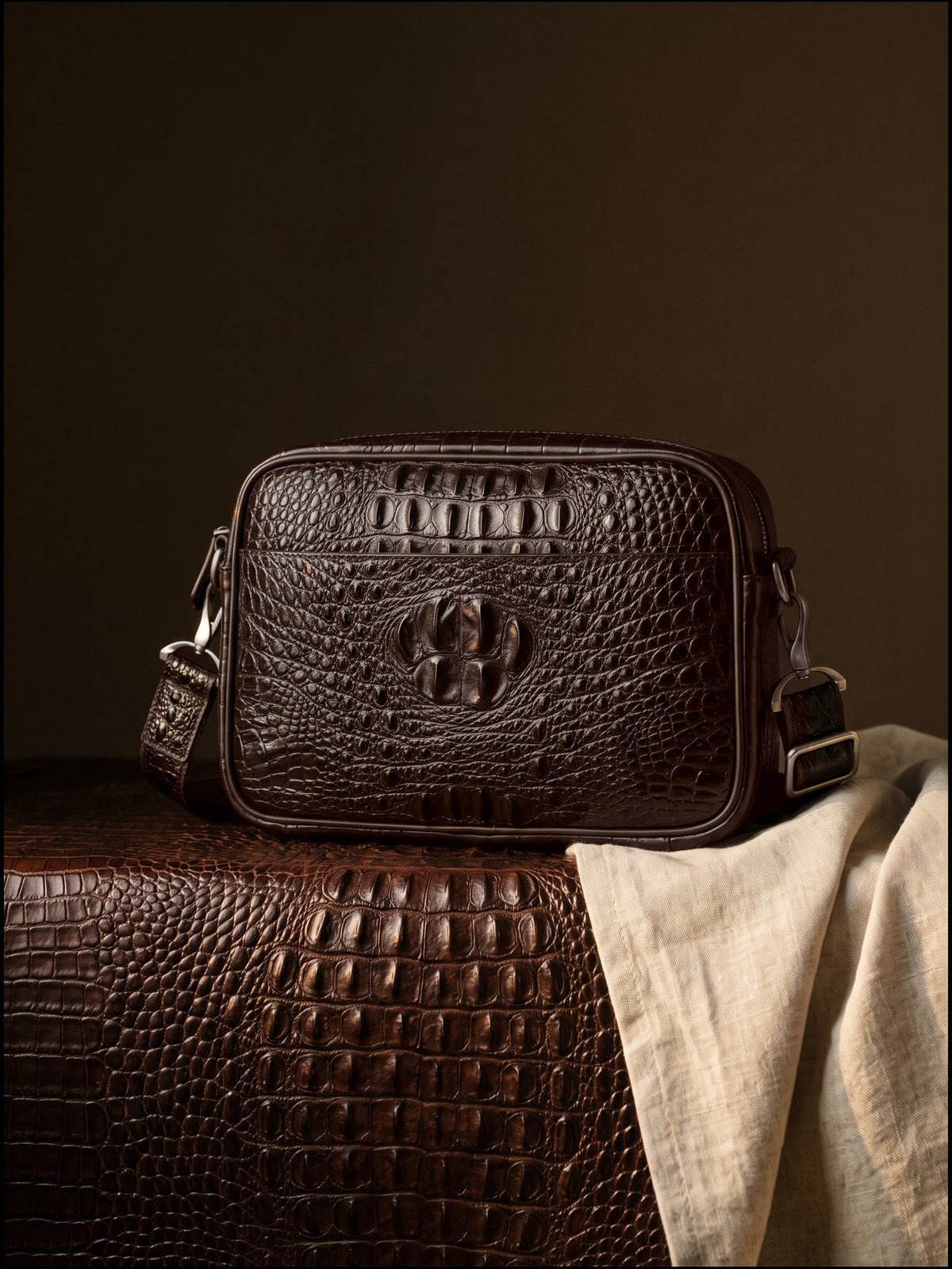 The Cassis Camera Bag — Brown, still life on crocodile leather